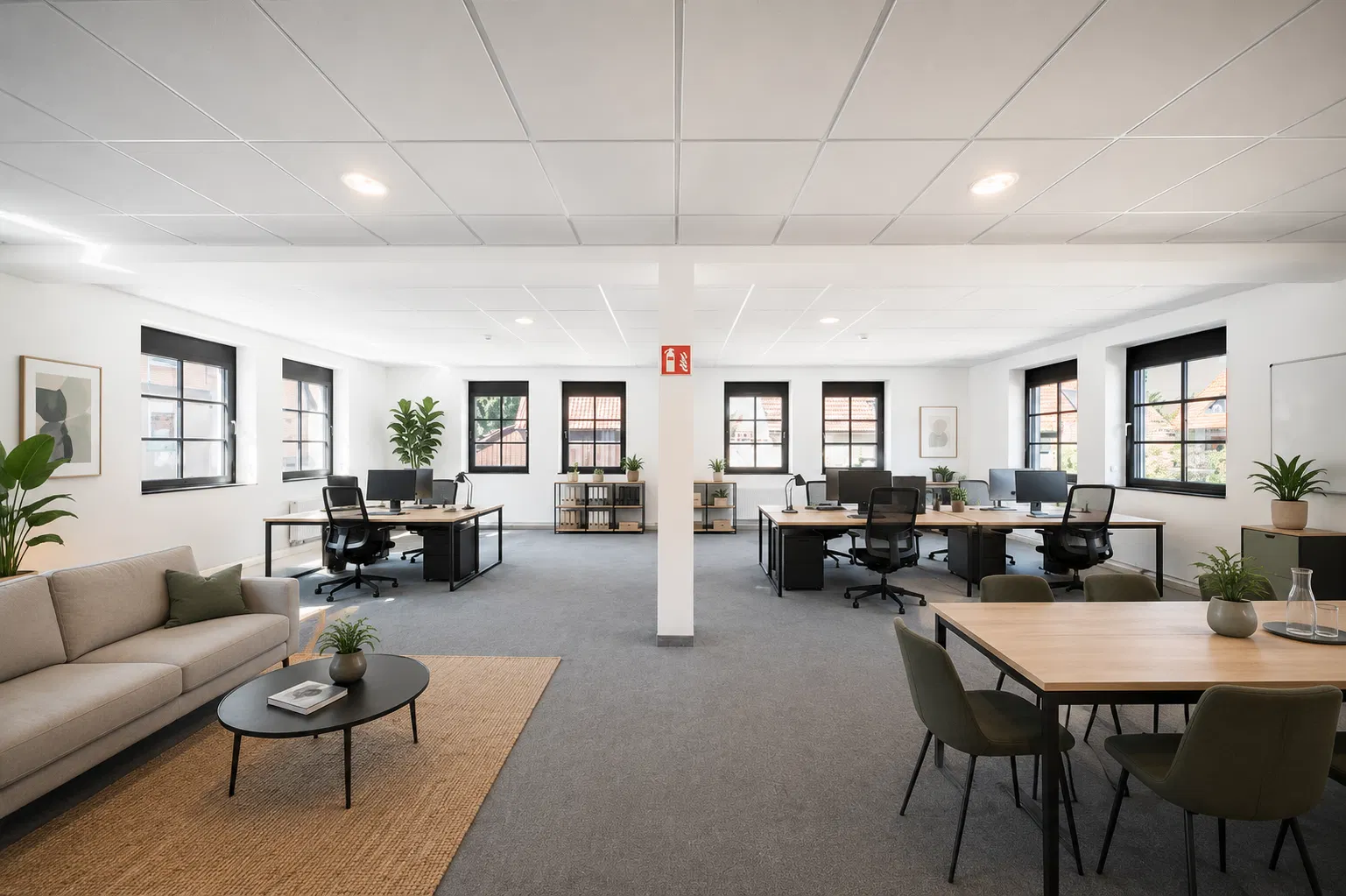 Büro nach Virtual Staging — eingerichtet mit Arbeitsplätzen und Lounge-Bereich